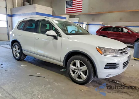 2013 Volkswagen Touareg Hybrid z USA, uszkodzony, nr VIN WVGEG9BP6DD001499